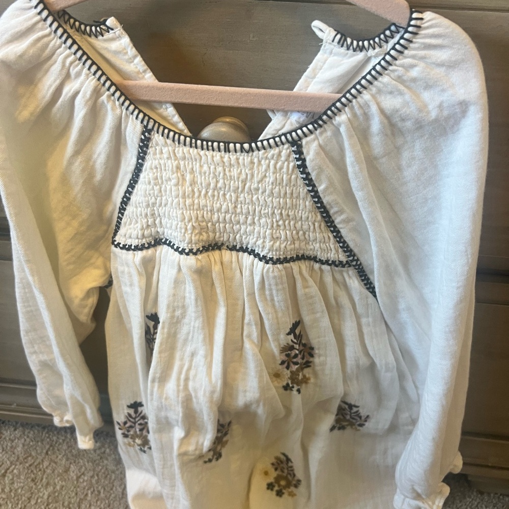 White Smocked Boho Blouse with Black Trim and Floral Embroidery